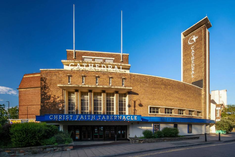 Photograph of the exterior of  an art deco style brick cinema converted to a church.