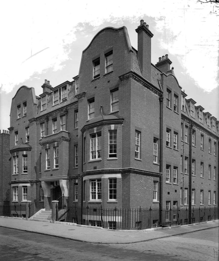 A 5 story brick building with Dutch style gables.