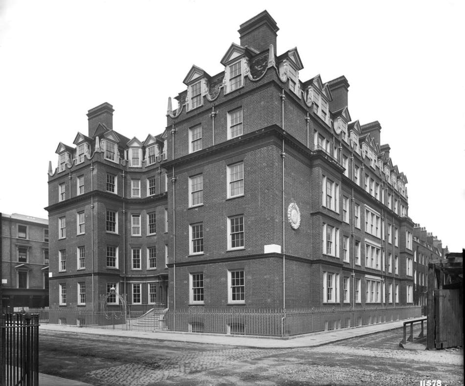 Sloane Gardens House, a large red brick building with decorative elements visible on the roofline.