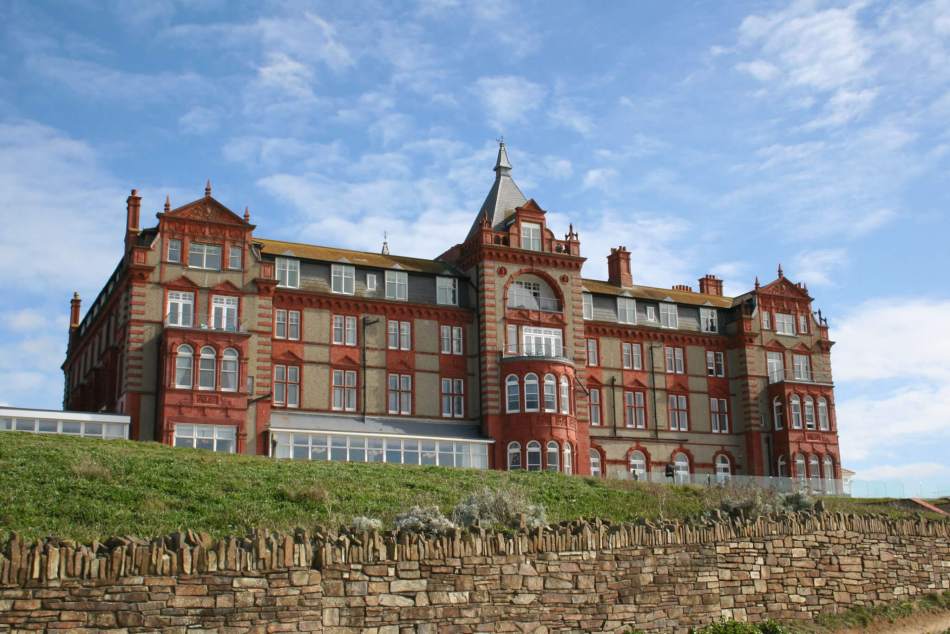 Colour photograph of a large historic hotel with four storeys.