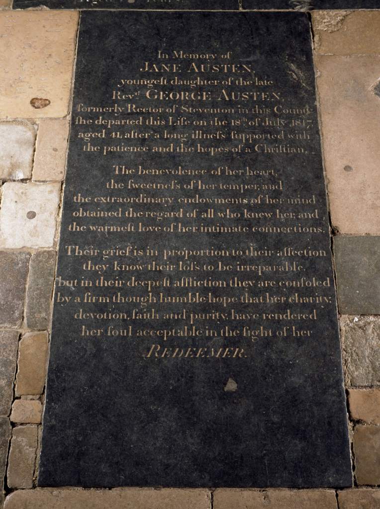 A photograph of a memorial stone on the floor of a cathedral dedicated to Jane Austen.