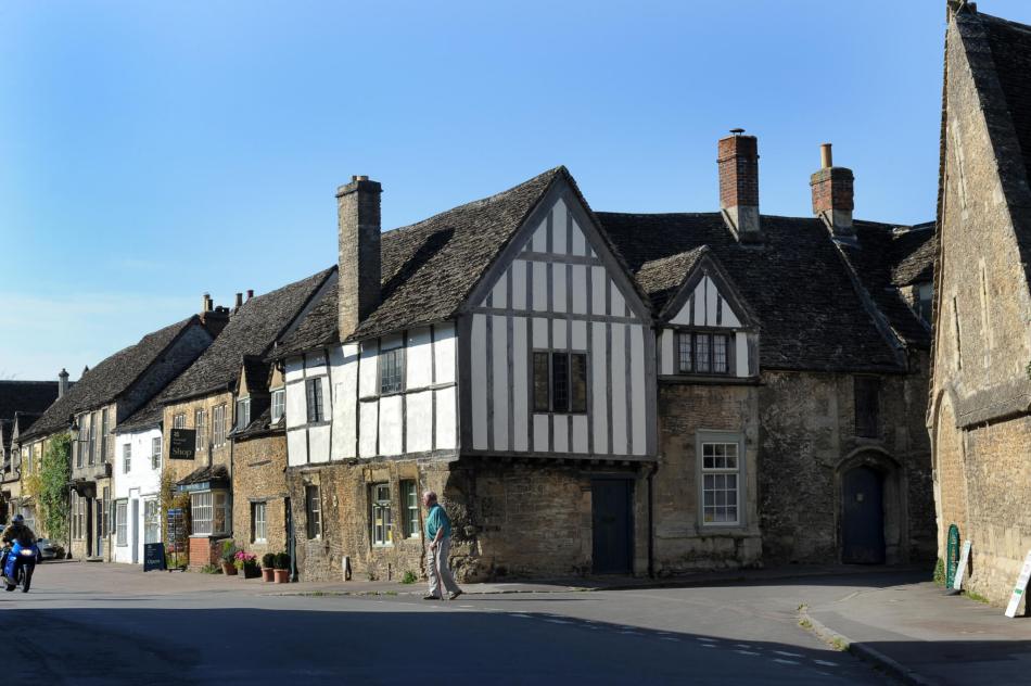 A photograph of a street featured terraced historic buildings.