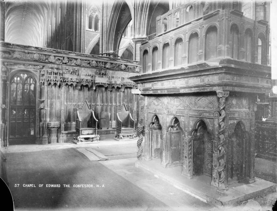 A black and white photograph of a shrine with ornate, decorative stonework in the centre of a chapel.