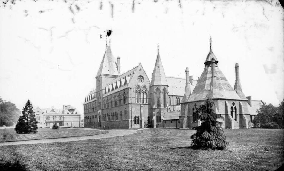 A black and white photograph of a Gothic building.