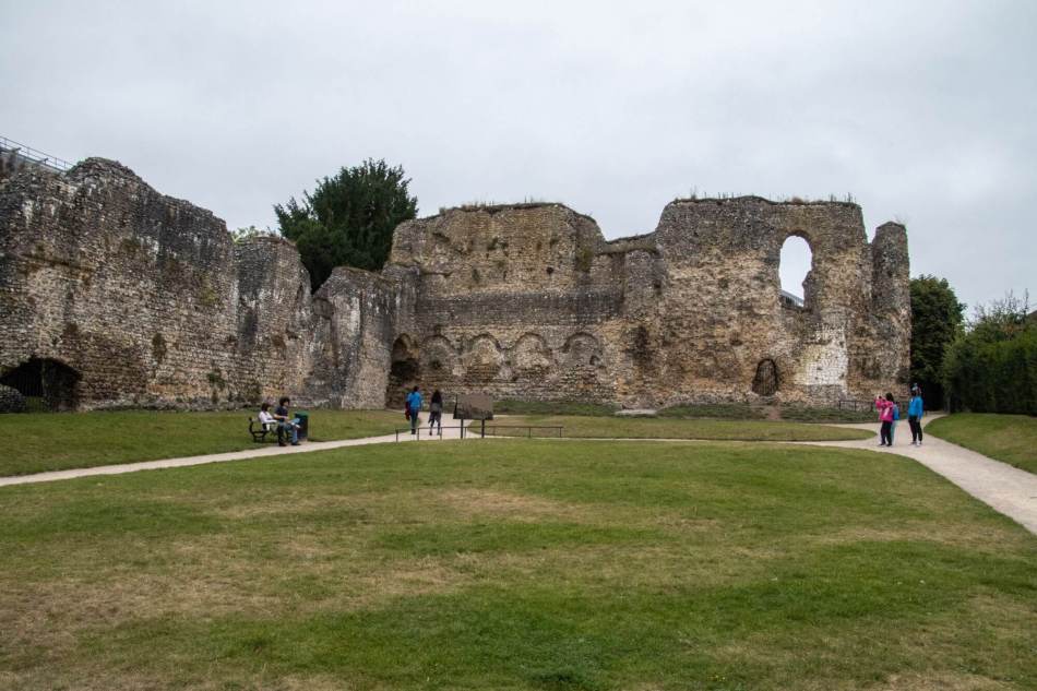 A photograph of the ruins of an abbey surrounded by grass.
