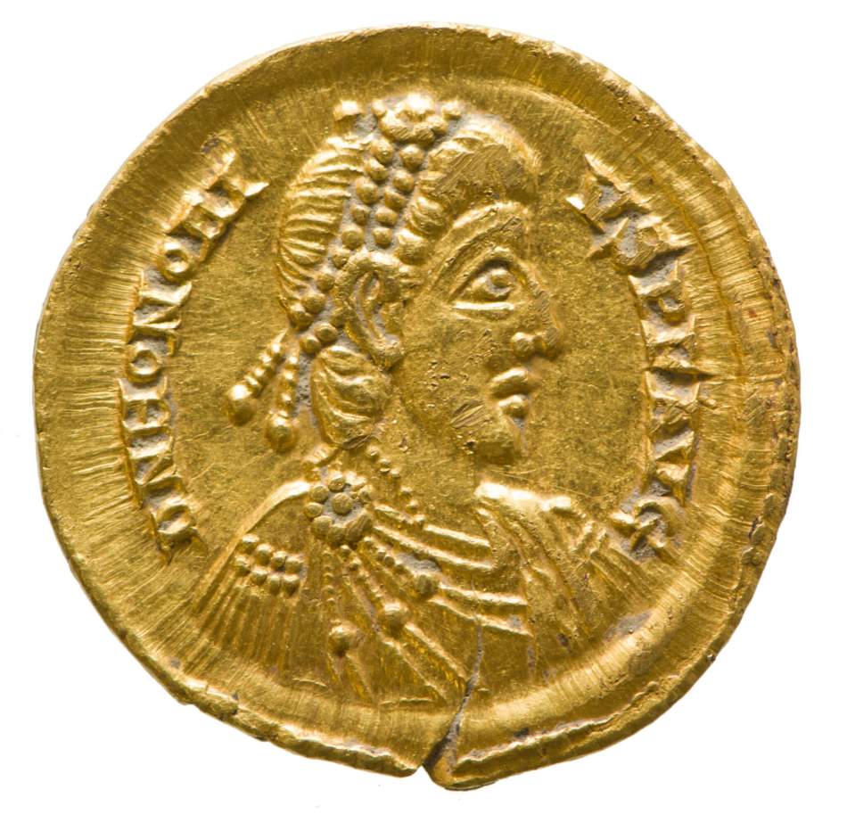 A gold coin with a portrait of a Roman Emperor wearing a diadem and armour, draped with a cloak.
