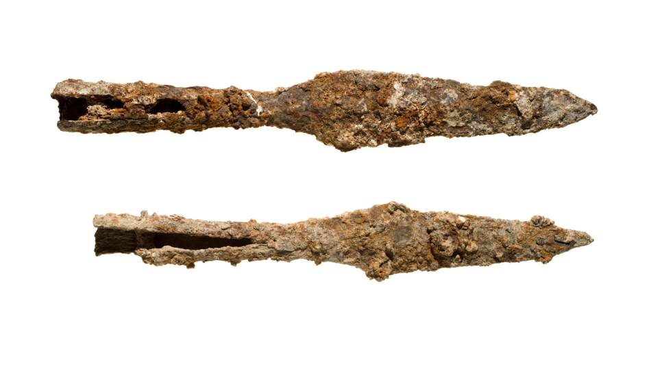 Photograph of two excavated iron spearheads.