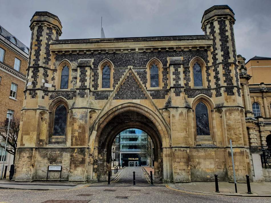 A photograph looking towards a large gatehouse.