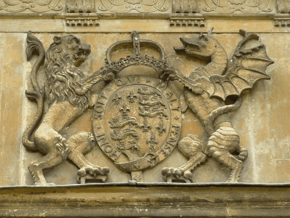 A close up photograph of Queen Elizabeth I coat of arms carved into stone.