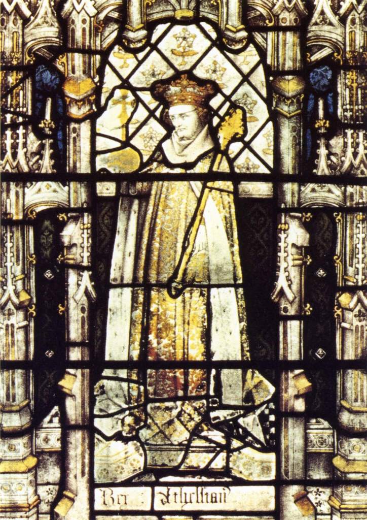 A photograph of a stained glass window showing King Æthelstan wearing a crown and robes.