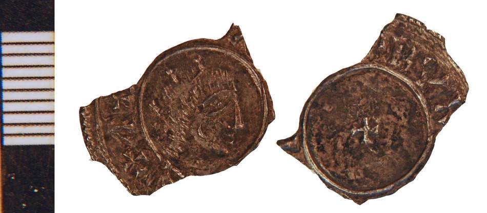 A photograph of the front and back of an old penny. A person wearing a crown is on the front of the coin.