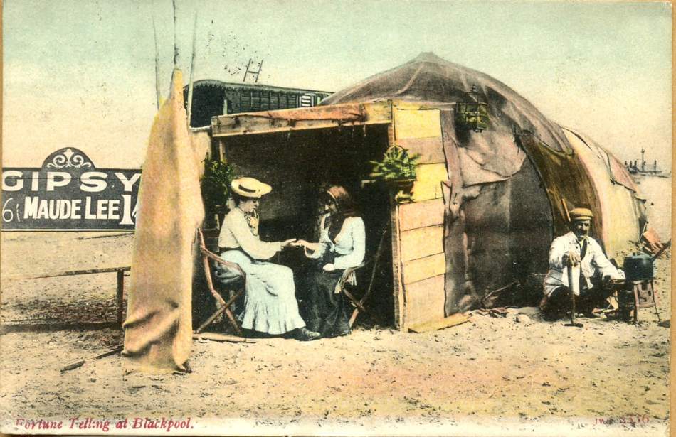 A postcard of a woman having her fortune read by a Gypsy. 