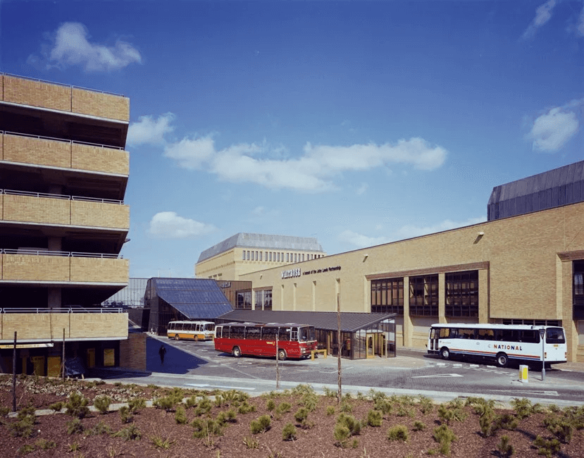 A photograph taken in the 1980s of a bus shelter.